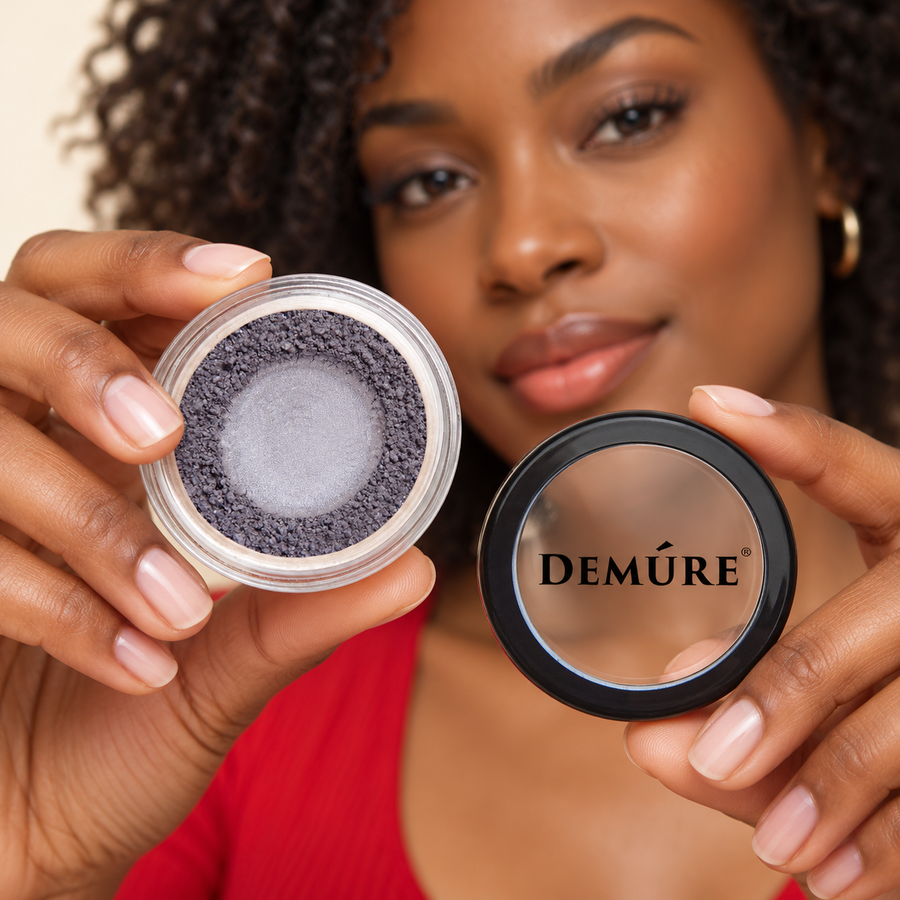 AI lifestyle image of a model holding Demure Castle Rock eyeshadow and its lid
