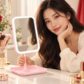 AI lifestyle image of a model presenting the pink LED Makeup Mirror
